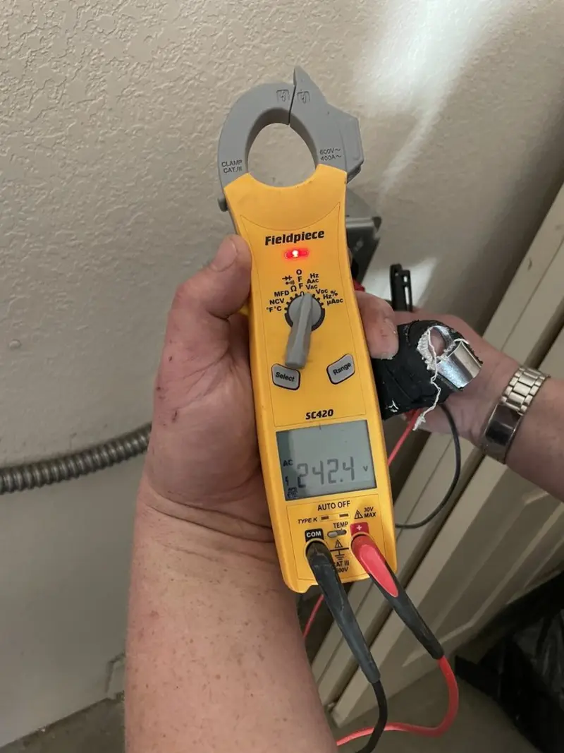 Voltage testing with clamp meter during Generator Installation in Fort Myers Beach